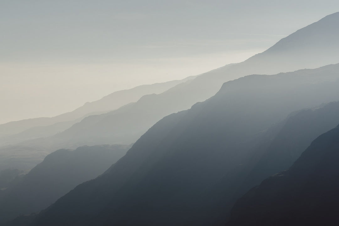 Layered blue mountain ridges in haze