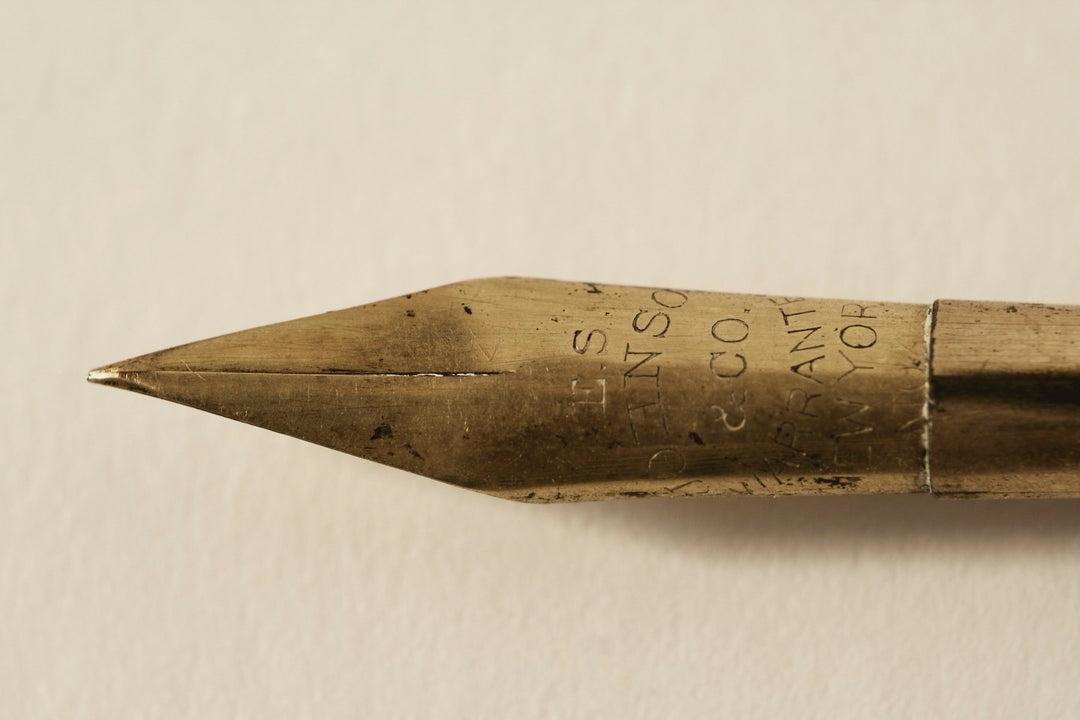 The gold nib of an antique fountain pen