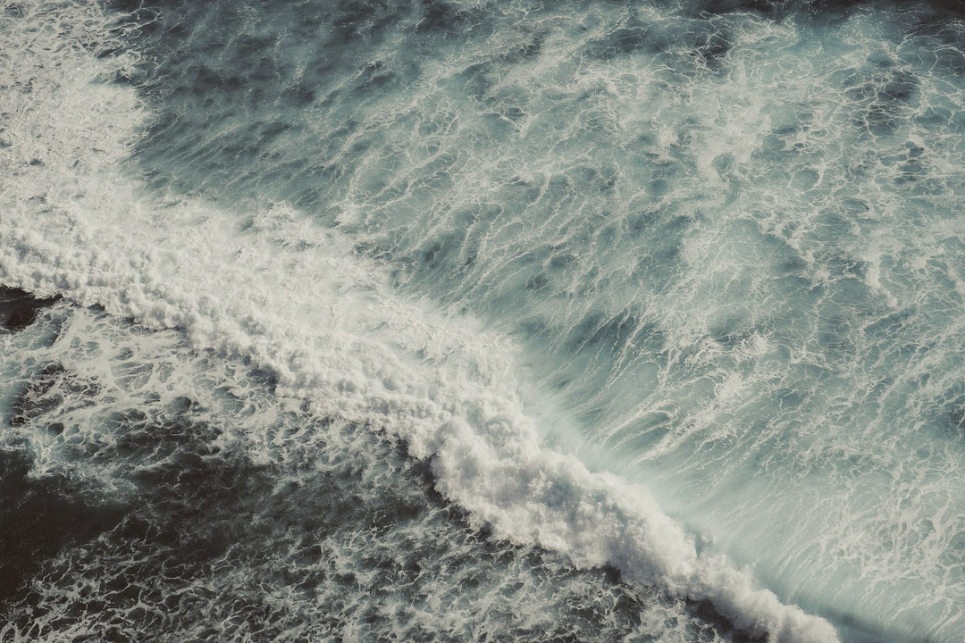 Foamy ocean waves seen from above