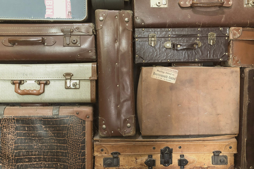 Vintage suitcases stacked high