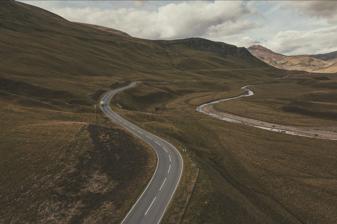 A road winding through open hills