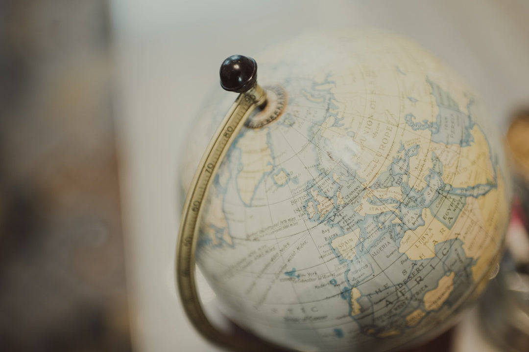 A vintage globe on a brass stand