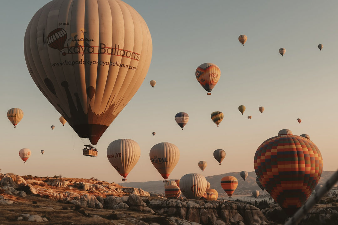 Hot air balloons drifting at sunrise