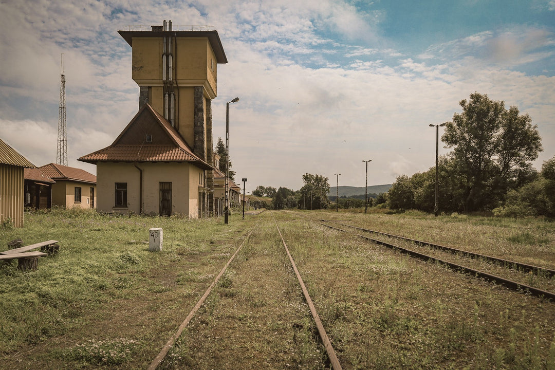 An old water tower beside a country railway line