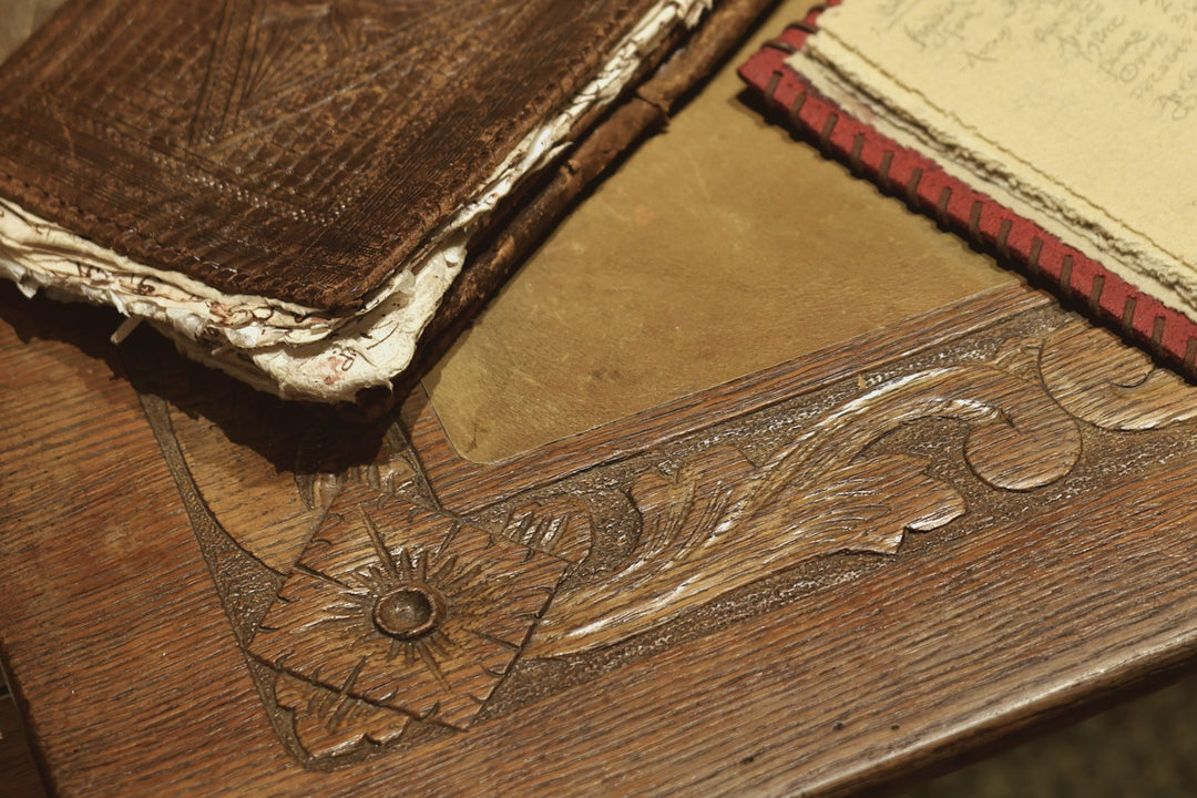The worn corner of an old leather book