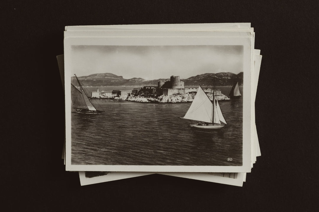 Old black and white photographs of a sailboat
